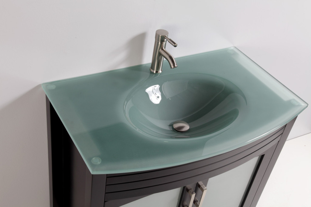 photos of green glass sink in bathroom