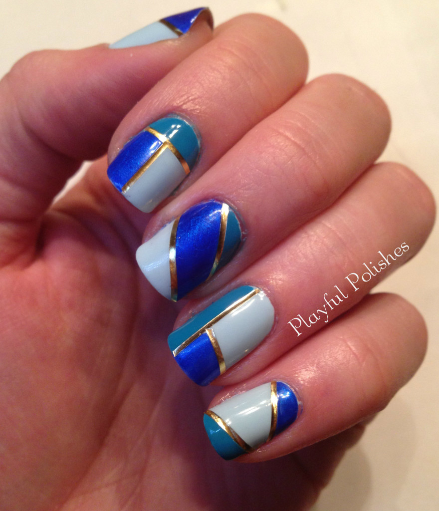 Blue and White Striped Nail Design with Gold Tape