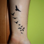 Small Birds Tattoos For Men on Wrist